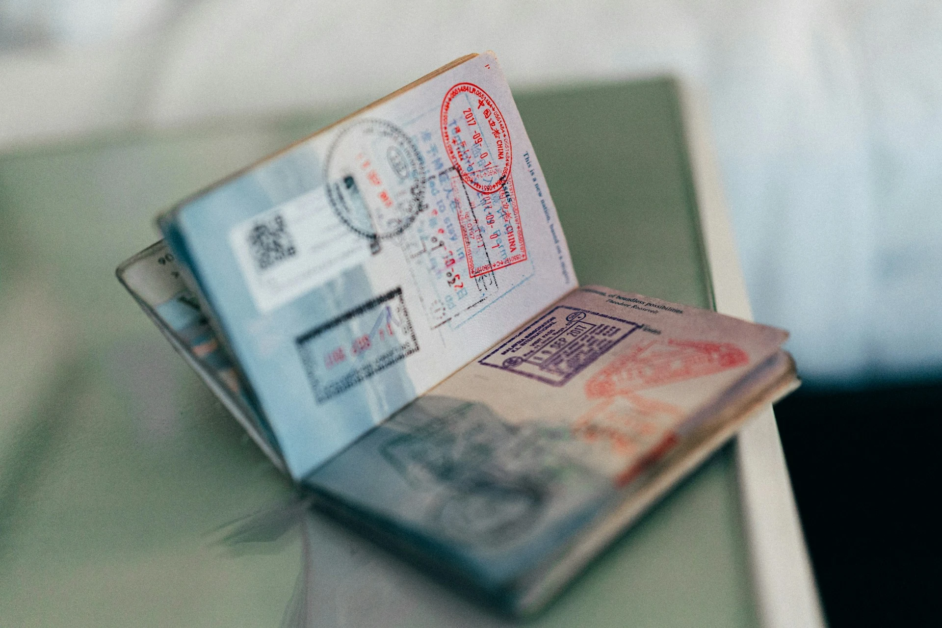 Passport with visas illustrating the visa application service provided by 2S Africa Travel