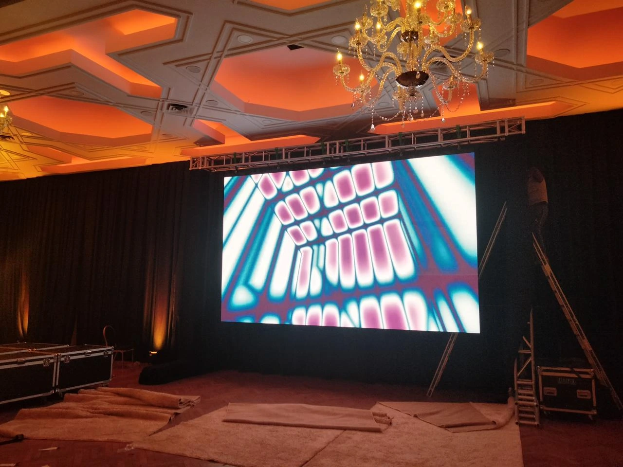 Technical setup of a professional event with a large screen as part of a custom event organized by 2S Africa Travel