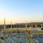 Al-Nabawi Mosque in Medina with its illuminated minarets and green dome