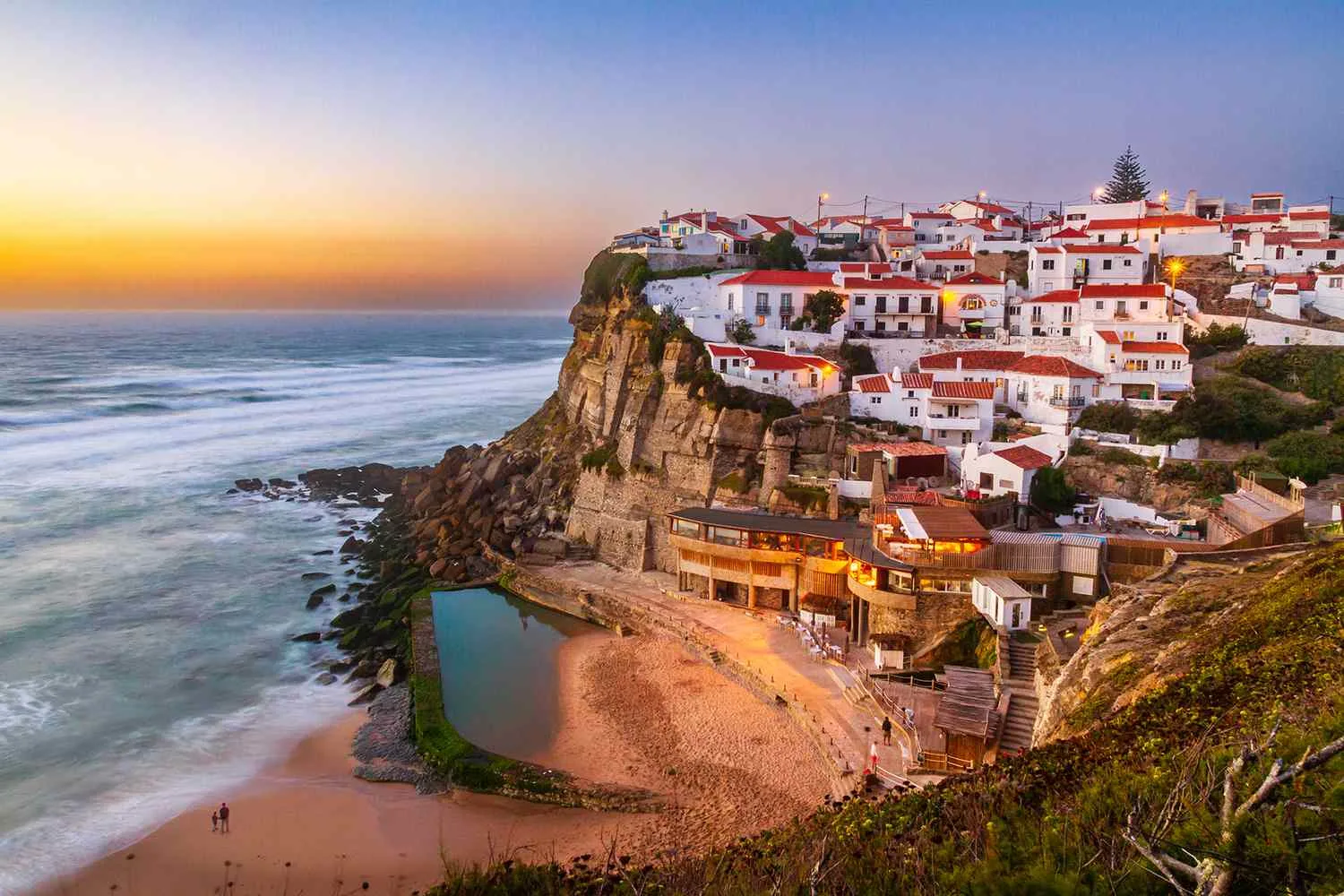 European coastal cliff village at sunset